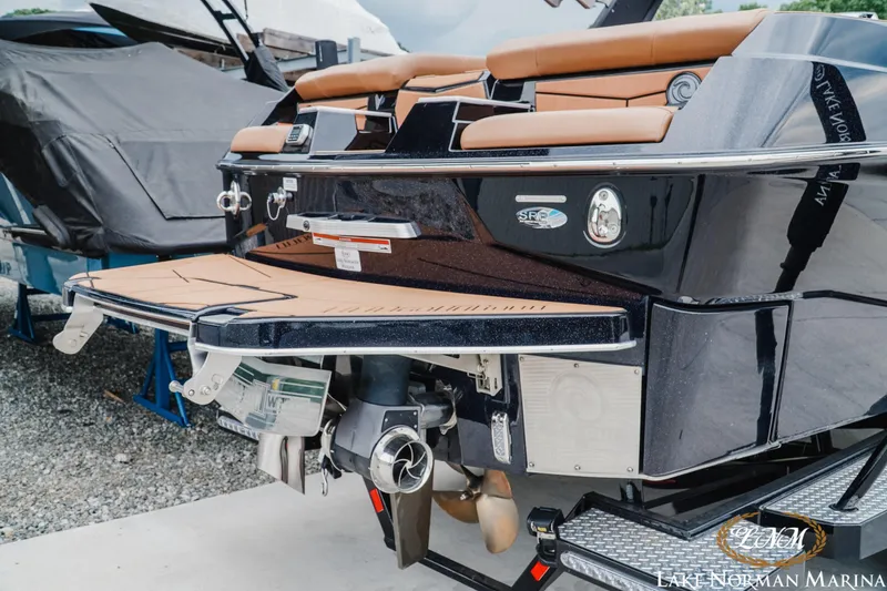Slide: The Image of 2021 Malibu M240 boat rear view with swim platform at Lake Norman Marina. - 6