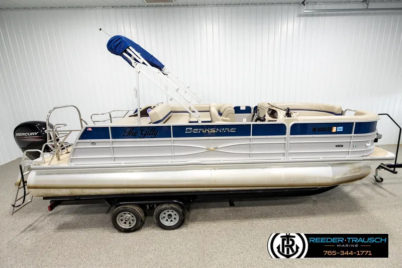 The Image of 2019 Berkshire 24 SB2 CTS pontoon boat on trailer in indoor showroom. - 1