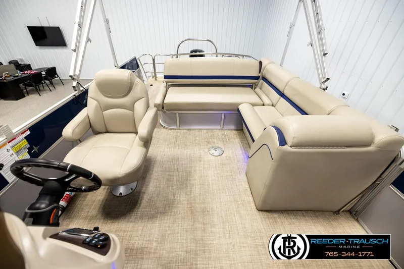 Slide: The Image of Interior of a 2019 Berkshire 24 SB2 CTS pontoon boat with beige seating and steering console. - 14