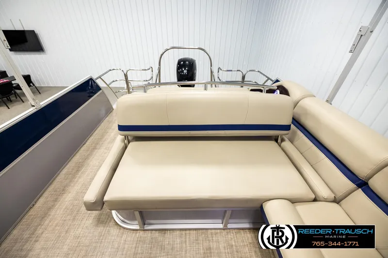 Slide: The Image of 2019 Berkshire 24 SB2 CTS pontoon boat interior with beige seating and blue accents. - 15
