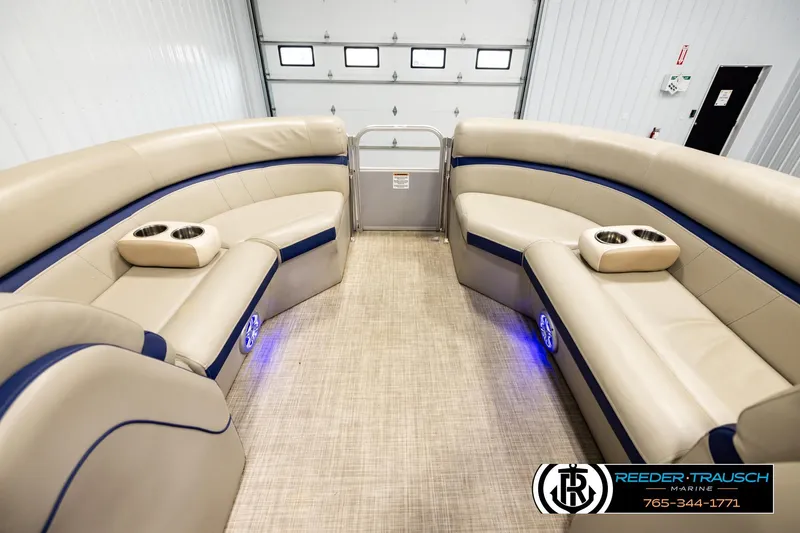 Slide: The Image of Interior of 2019 Berkshire 24 SB2 CTS pontoon boat with beige seating and cup holders. - 18