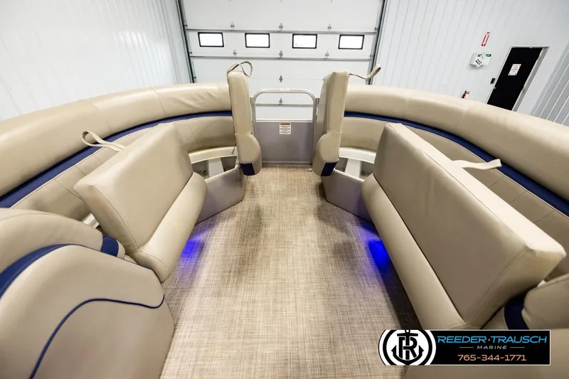 Slide: The Image of Interior of 2019 Berkshire 24 SB2 CTS pontoon boat with beige seating and blue accents. - 20