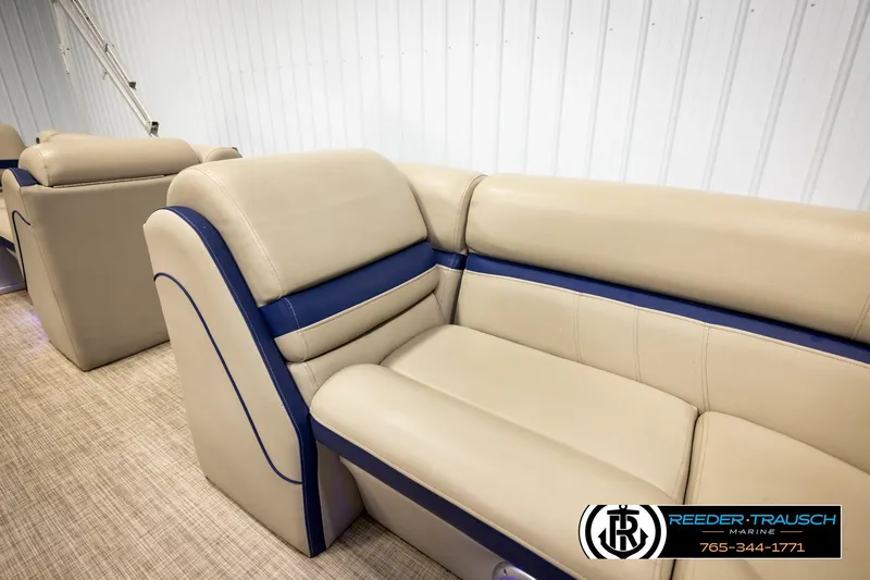 Slide: The Image of 2019 Berkshire 24 SB2 CTS boat interior with beige and blue seating. - 21