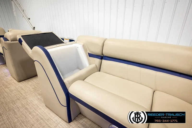 Slide: The Image of Interior of 2019 Berkshire 24 SB2 CTS pontoon boat with beige seating and storage compartment. - 22