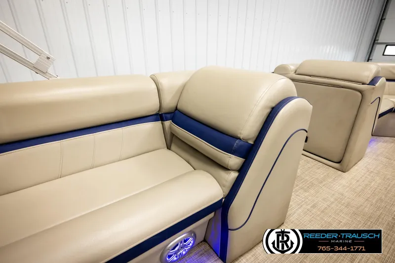 Slide: The Image of 2019 Berkshire 24 SB2 CTS boat interior with beige and blue seating. - 25