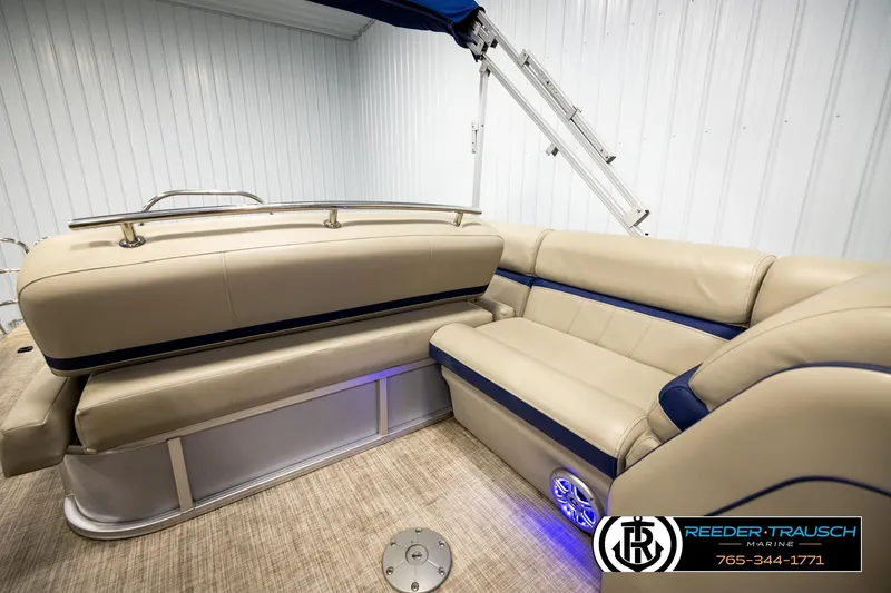 Slide: The Image of 2019 Berkshire 24 SB2 CTS pontoon boat interior with beige and blue seating. - 27