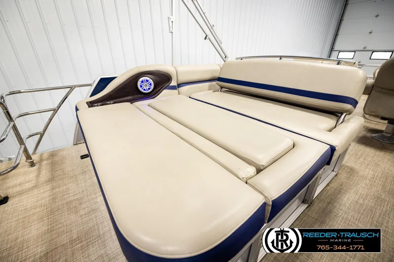 Slide: The Image of 2019 Berkshire 24 SB2 CTS pontoon boat interior with beige seating and blue accents. - 32