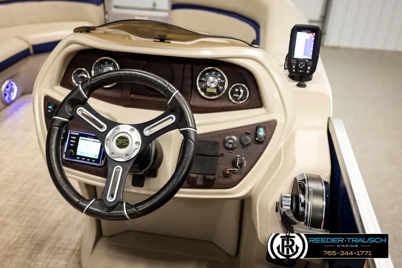 Slide: The Image of 2019 Berkshire 24 SB2 CTS boat dashboard with steering wheel and control panel. - 35