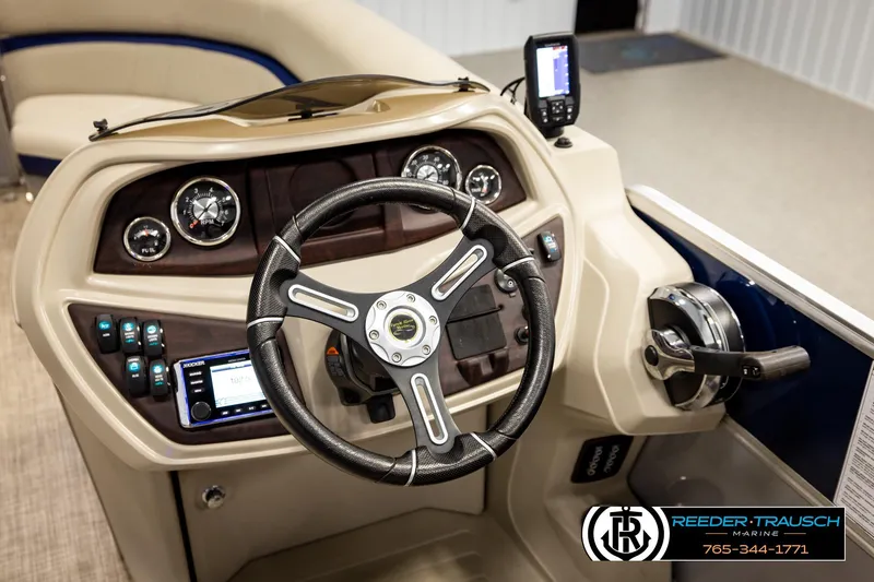 Slide: The Image of 2019 Berkshire 24 SB2 CTS boat dashboard with steering wheel and control panel. - 36