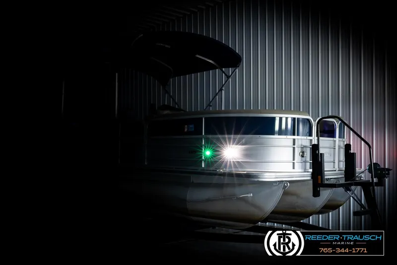 Slide: The Image of 2019 Berkshire 24 SB2 CTS pontoon boat in dimly lit storage facility. - 4