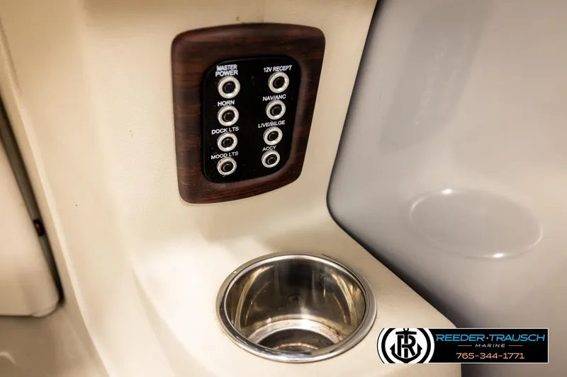 Slide: The Image of Control panel and cup holder on 2019 Berkshire 24 SB2 CTS boat interior. - 43