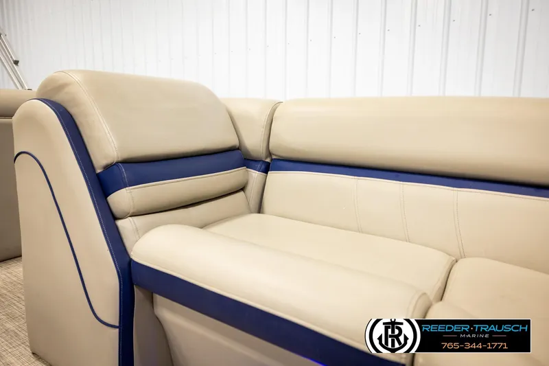 Slide: The Image of 2019 Berkshire 24 SB2 CTS boat interior with beige and blue seating. - 45