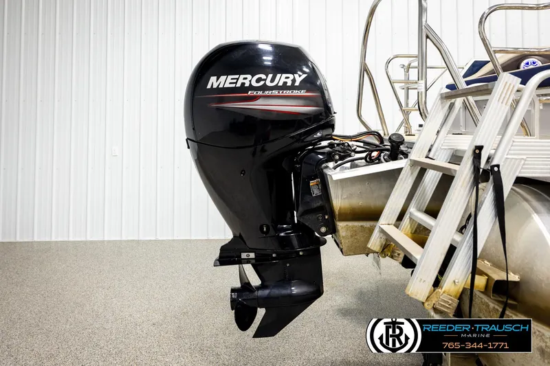 Slide: The Image of 2019 Berkshire 24 SB2 CTS with Mercury FourStroke outboard motor in a showroom. - 49