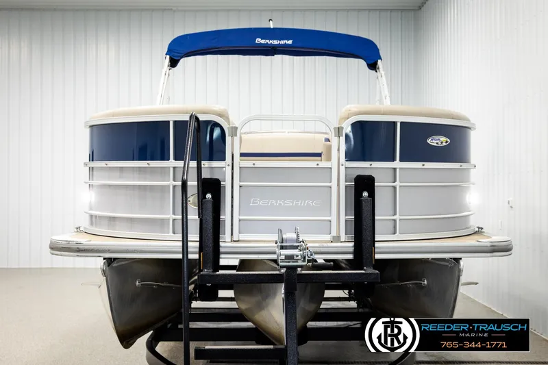 Slide: The Image of 2019 Berkshire 24 SB2 CTS pontoon boat with blue canopy in showroom. - 8