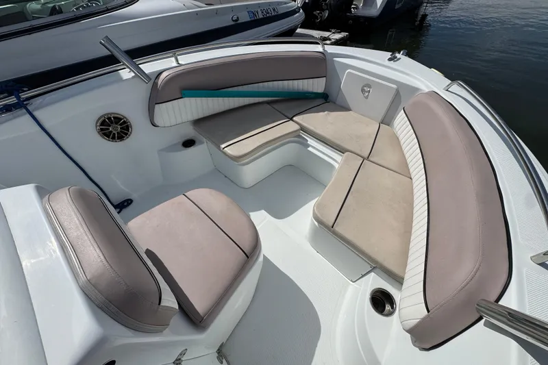 Slide: The Image of 2022 Barracuda 188 CCR boat interior with cushioned seating and speaker. - 11