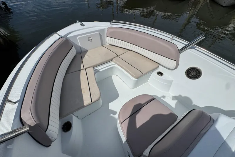 Slide: The Image of 2022 Barracuda 188 CCR boat interior with cushioned seating and water view. - 13