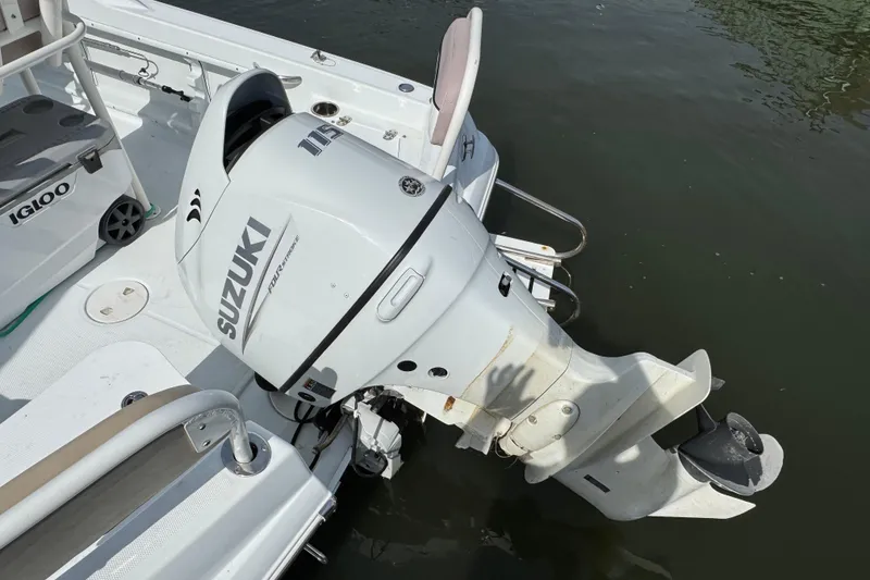 Slide: The Image of 2022 Barracuda 188 CCR boat with Suzuki outboard motor on water. - 2