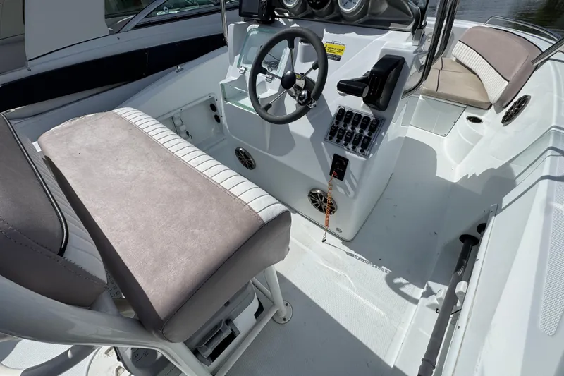 Slide: The Image of 2022 Barracuda 188 CCR boat interior with steering wheel and control panel. - 5