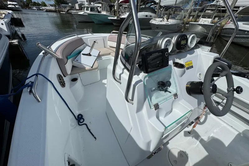 Slide: The Image of 2022 Barracuda 188 CCR boat interior with steering wheel and dashboard controls. - 9