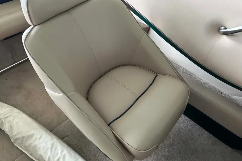 Slide: The Image of Beige leather seat in a 1997 Crownline 225 BR boat interior. - 13