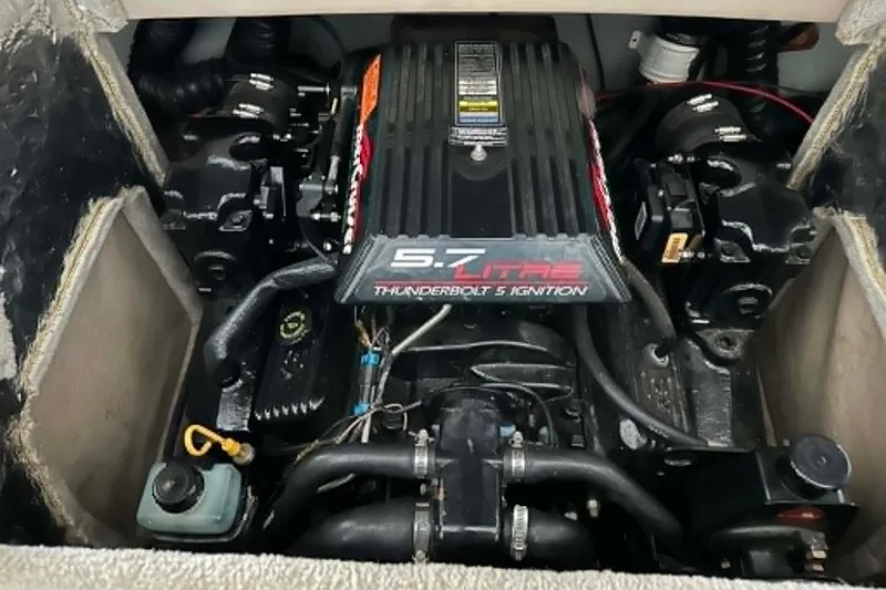Slide: The Image of Engine compartment of a 1997 Crownline 225 BR boat with 5.7L Thunderbolt ignition. - 14