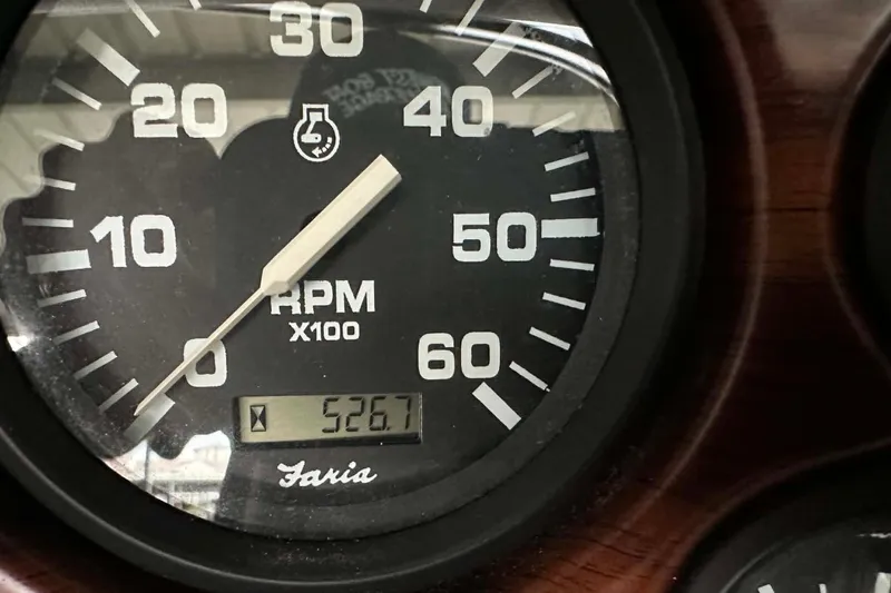 Slide: The Image of Close-up of a 1997 Crownline 225 BR tachometer showing 526.7 hours. - 5