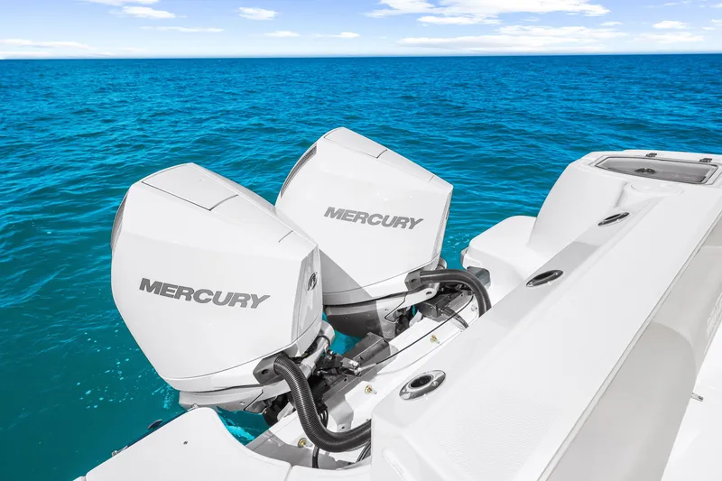 Slide: The Image of Two Mercury outboard engines on a Boston Whaler 285 Conquest in open sea. - 19