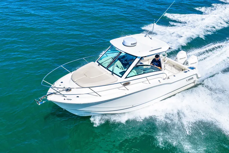 Slide: The Image of A 2027 Boston Whaler 285 Conquest speeds across the blue water. - 1