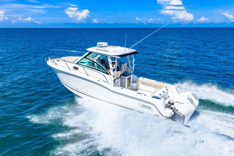 Slide: The Image of A 2027 Boston Whaler 285 Conquest speeds across the blue ocean. - 5