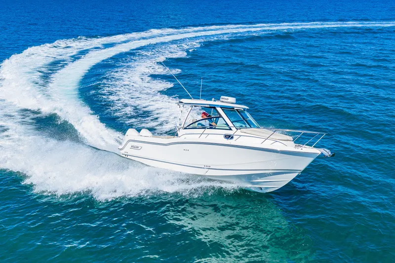 Slide: The Image of A white motorboat speeds across the blue sea, leaving a trail of waves behind. - 7