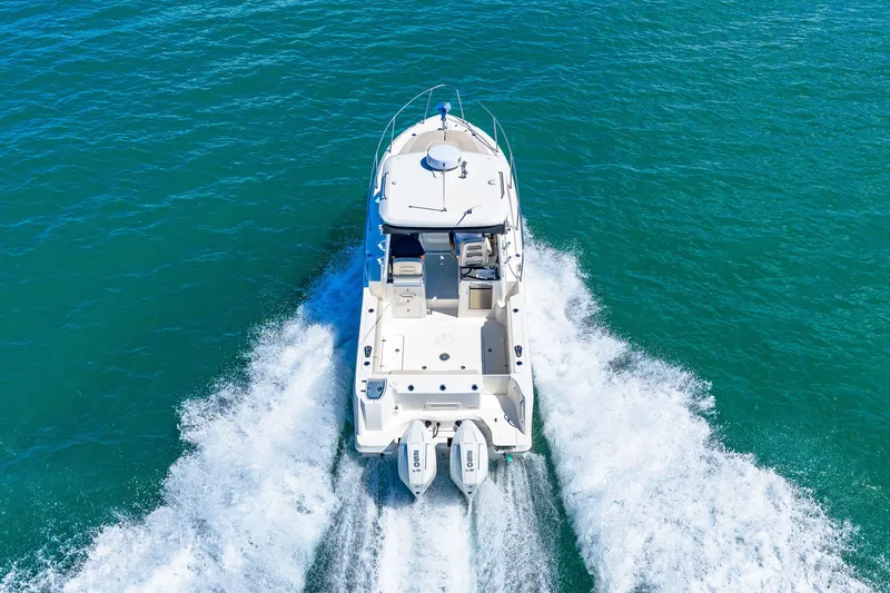 Slide: The Image of A 2027 Boston Whaler 285 Conquest speeds across the blue water. - 11