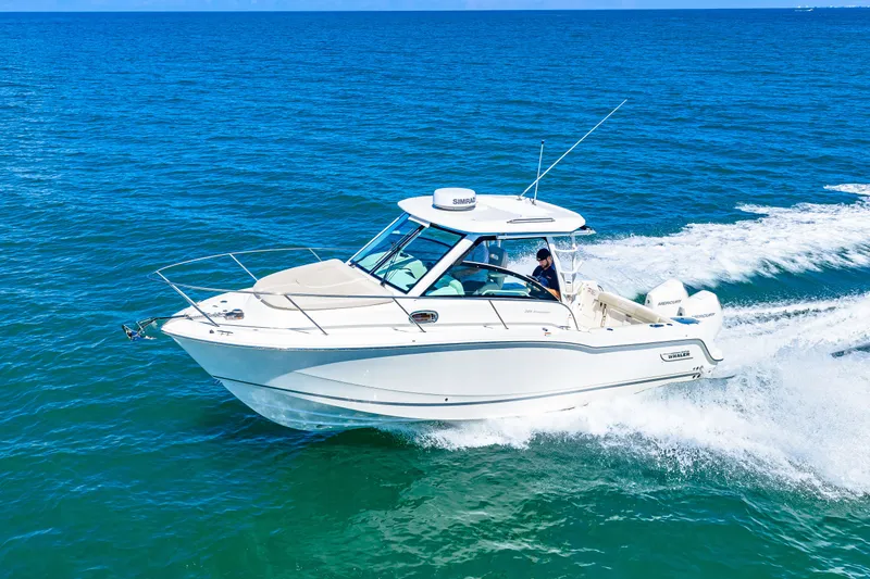 Slide: The Image of A 2027 Boston Whaler 285 Conquest speeds across the blue sea. - 0
