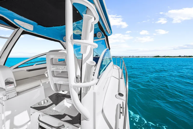 Slide: The Image of The image shows a Boston Whaler 285 Conquest boat on the water with a blue sky. - 36