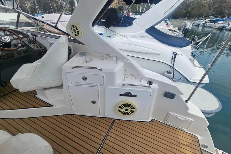 Slide: The Image of 2009 Regal 2860 Window Express boat interior with seating and control panel. - 11