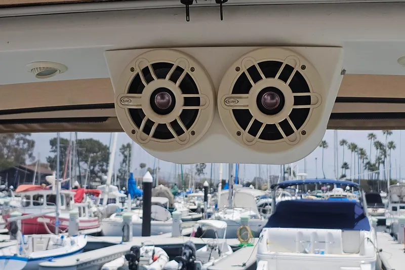 Slide: The Image of Speakers on a 2009 Regal 2860 Window Express boat, docked in a marina. - 14