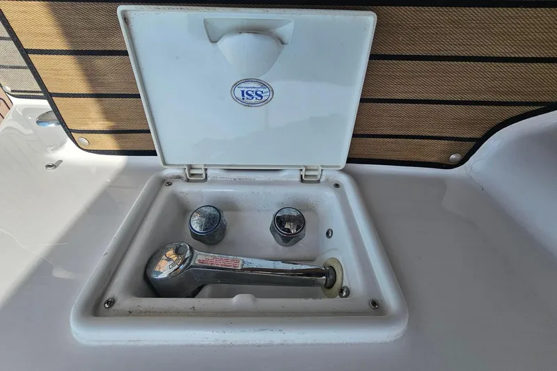 Slide: The Image of Boat faucet compartment on 2009 Regal 2860 Window Express. - 16