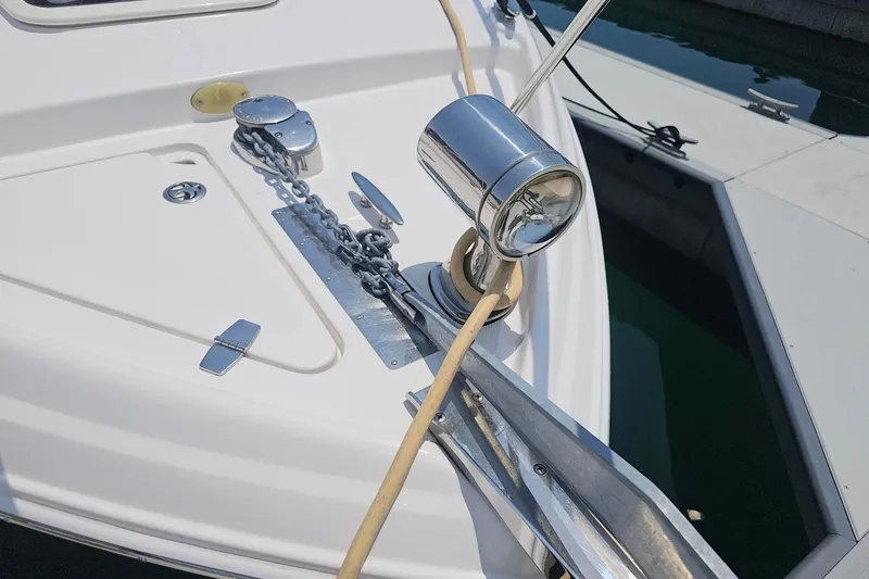 Slide: The Image of 2009 Regal 2860 Window Express boat anchor and chain detail at dock. - 20