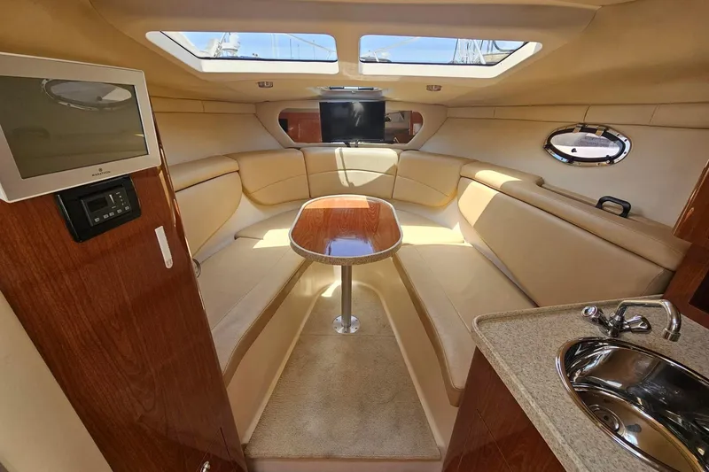 Slide: The Image of Luxurious interior of 2009 Regal 2860 Window Express yacht with seating and kitchenette. - 25