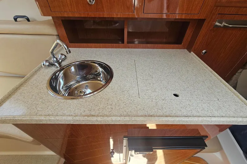 Slide: The Image of 2009 Regal 2860 Window Express boat interior with sink and countertop. - 27