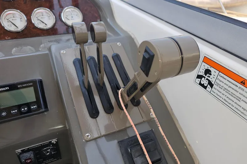 Slide: The Image of 2009 Regal 2860 Window Express boat controls and dashboard close-up. - 8