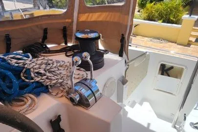 Slide: The Image of 2016 Lagoon 450 F yacht deck with ropes and winch. - 10