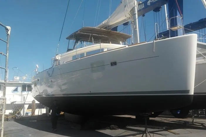 Slide: The Image of 2016 Lagoon 450 F catamaran on dry dock, ready for maintenance. - 11
