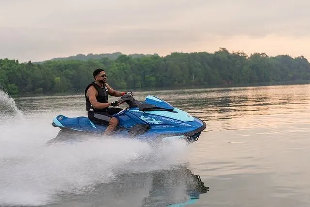 Slide: The Image of Man riding 2026 Yamaha WaveRunner VX Cruiser on a lake. - 5