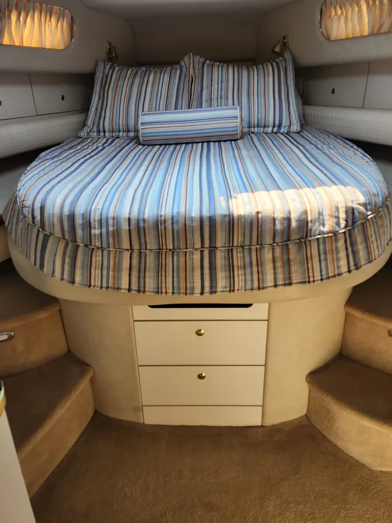 Slide: The Image of Interior of 1997 Sea Ray 450 Sundancer with cozy bed. - 11