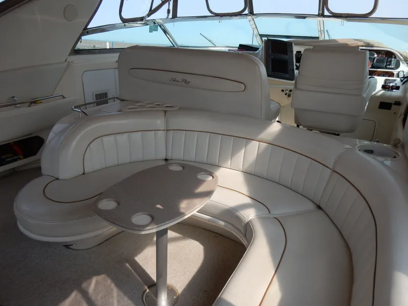 Slide: The Image of Interior of a 1997 Sea Ray 450 Sundancer yacht with leather seating. - 12