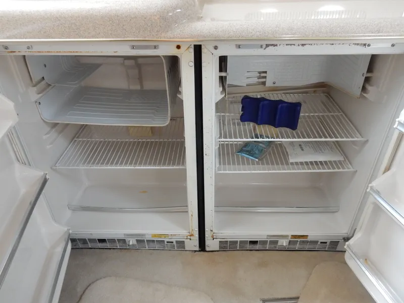 Slide: The Image of Empty fridge in 1997 Sea Ray 450 Sundacer boat. - 21