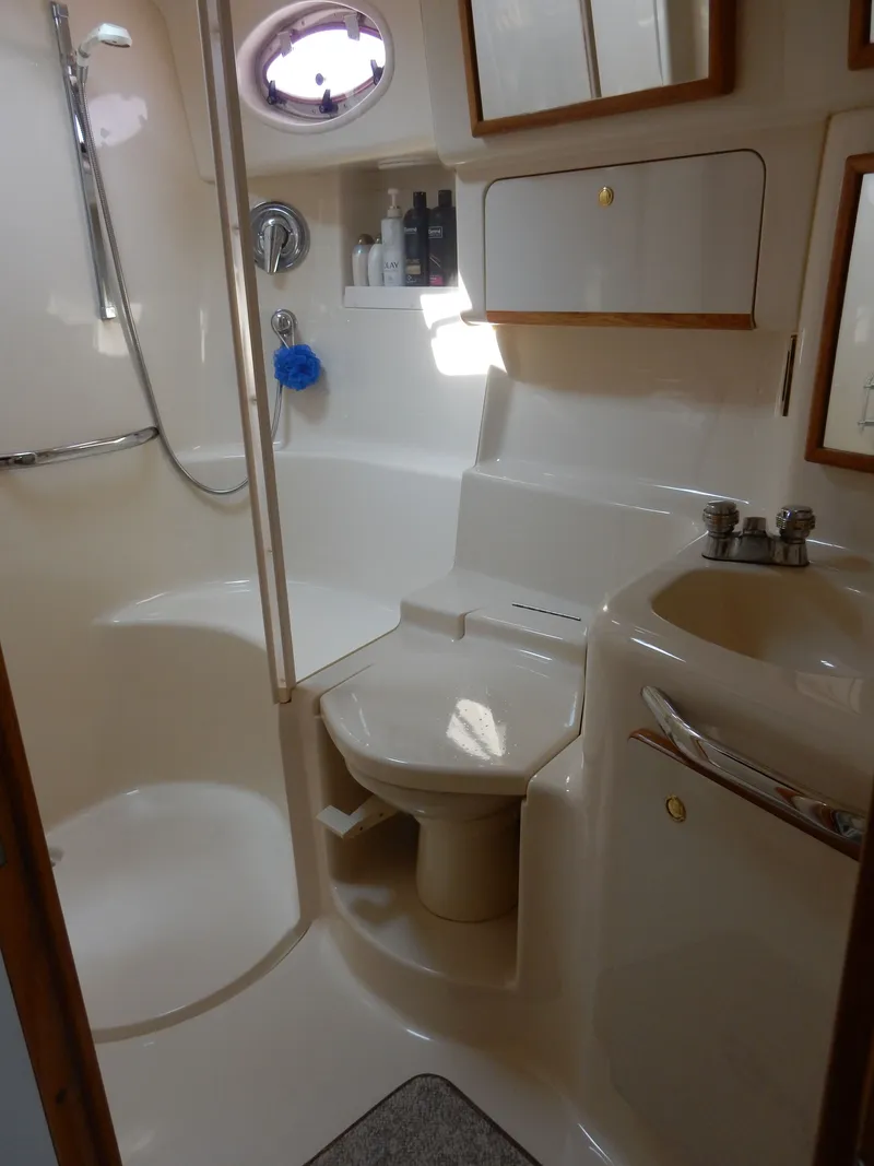 Slide: The Image of Bathroom of the 1997 Sea Ray 450 Sundancer yacht. - 23