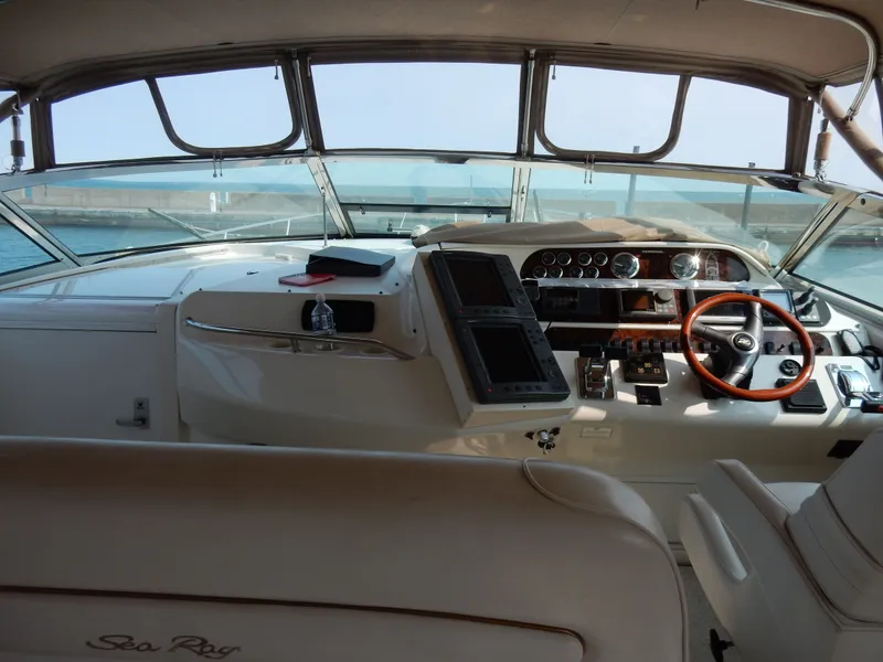 Slide: The Image of Interior view of a 1997 Sea Ray 450 Sundancer yacht cockpit. - 4