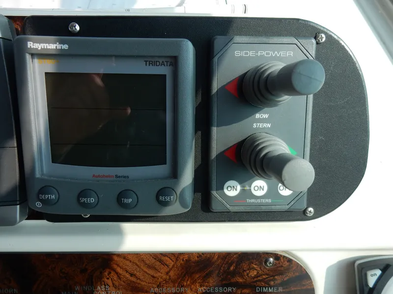 Slide: The Image of Raymarine Tridata and Side-Power controls on 1997 Sea Ray 450 Sundacer. - 6