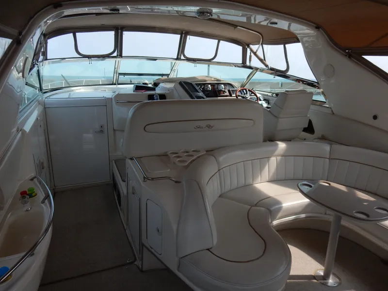 Slide: The Image of Interior of a 1997 Sea Ray 450 Sundancer yacht with elegant seating area. - 9